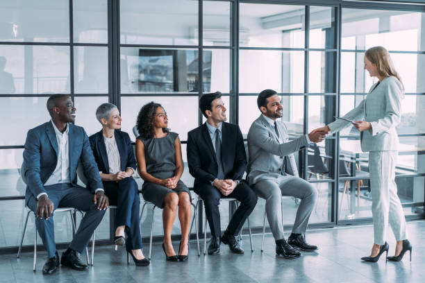 hr manager handshaking with candidate at job interview. - job search hire me occupation imagens e fotografias de stock