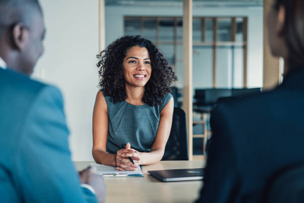 group of business persons talking in the office. - interview meeting business women imagens e fotografias de stock