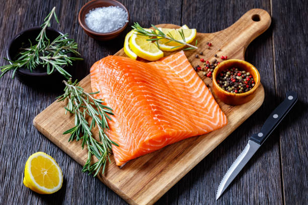 istock Fresh salmon fish fillet on wooden board 1365439067
