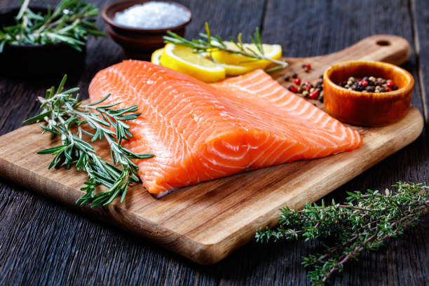 istock Fresh salmon fish fillet on wooden board 1365439068