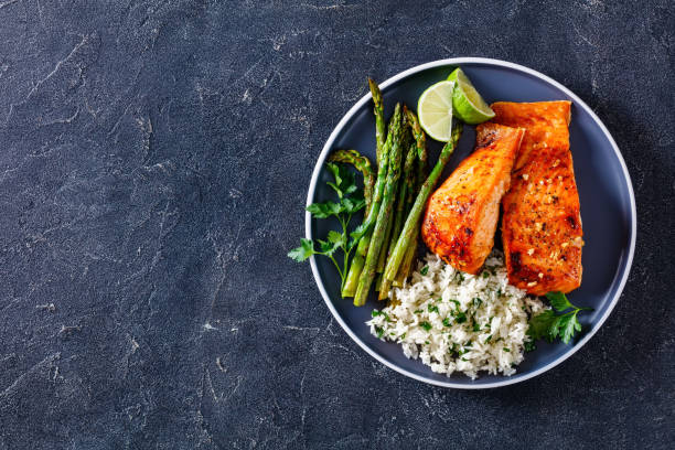 istock fried salmon fish fillet with rice and asparagus 1365439776