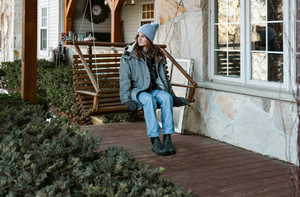 istock Young woman getting ready for a winter walk in the nature 1365440970