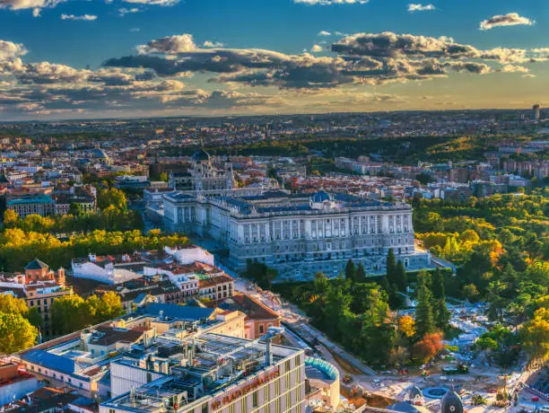 Photo of panoramic view from the top of the historic center of Madrid at sunset with royal palace in first view