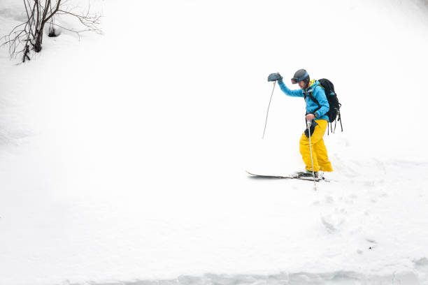 istock Young caucasian skier walking a snow wall at the Pyrenees. 1365446377