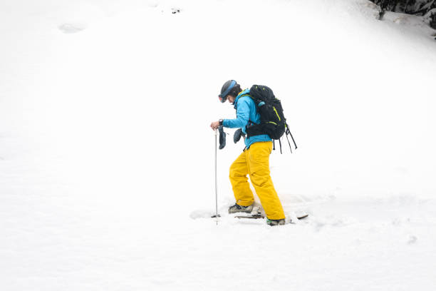 istock Young caucasian skier walking a snow wall at the Pyrenees. 1365446378