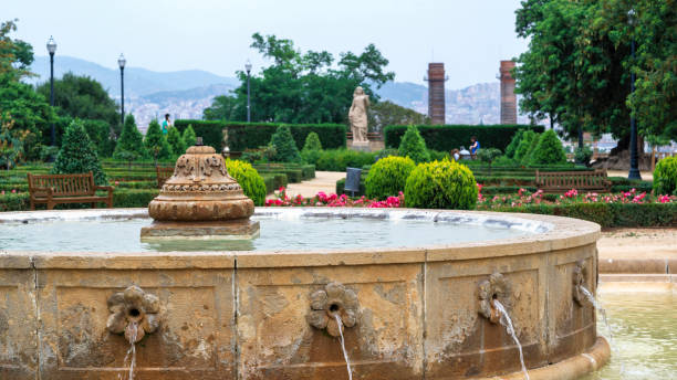 istock Park with mutiple greenery, fountain in Barcelona 1365446415