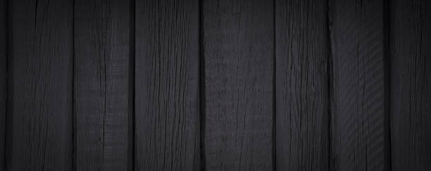 istock Black wooden planks texture background 1365446437
