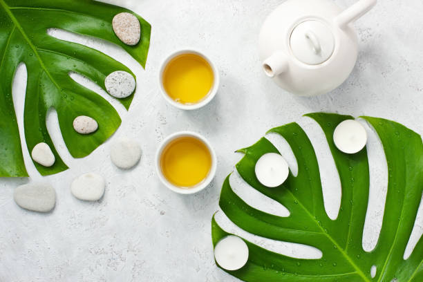 istock Asian tea bowls and teapot  on light stone table. Top view with copy space 1365447566