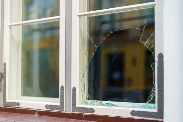 istock Broken window in the house. Vandalism and pogroms. 1365447922