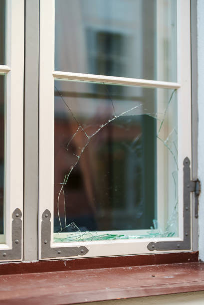 istock Broken window in the house. Vandalism and pogroms. 1365447928