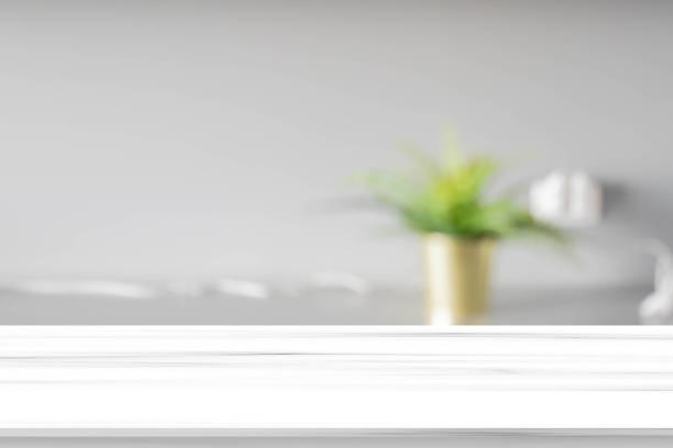 istock blurred inside of interior luxury modern bathroom in the morning background with white concrete tiled  tabletop for show, promote ads and design product on display concept 1365448014