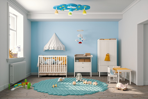 Baby's bedroom with furniture in pastel colors.