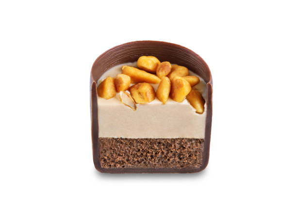 Dark chocolate nut cream roasted nuts candy on a white isolated background