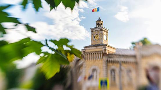 The City Hall in the center of Chisinau, Moldova, trees. Lensbaby artistic blur