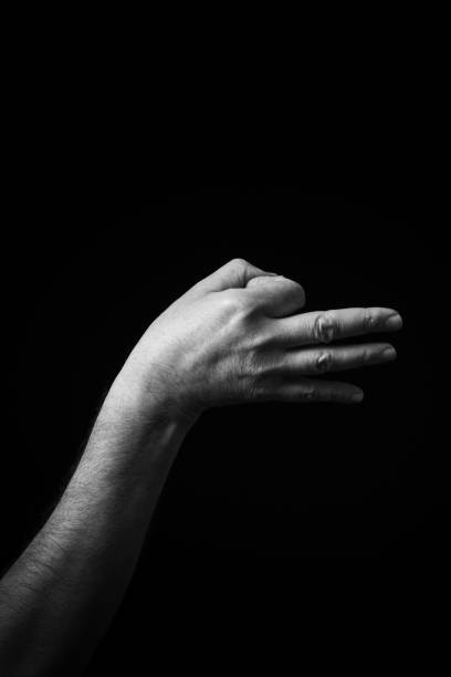 istock B+W image of hand demonstrating Chinese sign language letter E isolated against black background 1365452347