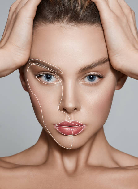 Aesthetic cosmetology, face care. Portrait of beautiful woman with lifting lines on skin stock photo