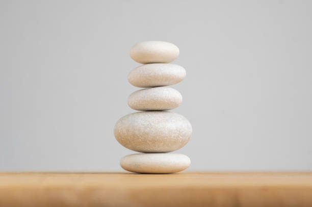 istock Stone cairn on white background, five stones tower, simple poise stones, simplicity harmony and balance, rock zen 1365453881