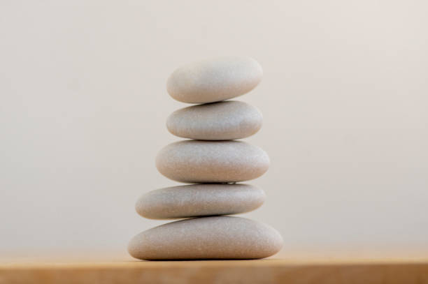 istock Stone cairn on white background, five stones tower, simple poise stones, simplicity harmony and balance, rock zen 1365453892