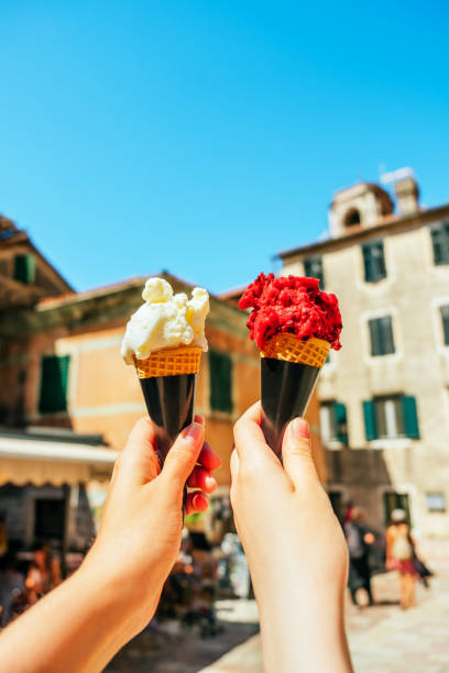 istock Woman hands holding gelato ice cream 1365456041