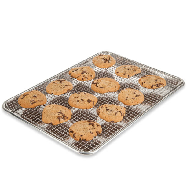 istock Chocolate chip cookies on a cooling rack and baking sheet 1365458963