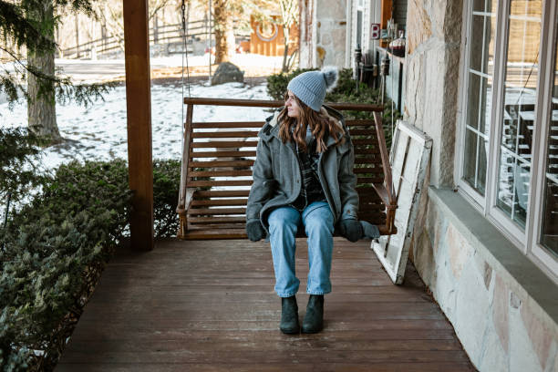 istock Young woman getting ready for a winter walk in the nature 1365460062