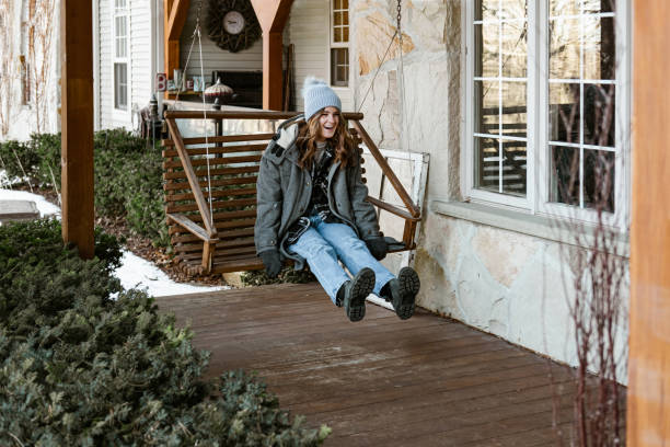 istock Young woman getting ready for a winter walk in the nature 1365460120