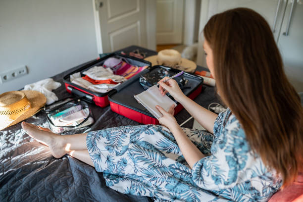 istock Young woman doing her last check to be sure if she have everything she needs for vacation 1365462119