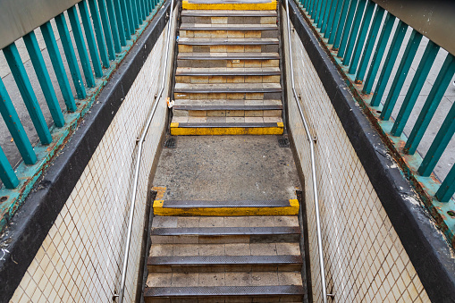 The Bronx, New York City, New York, USA. Stairs descending to the subway.