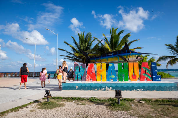 Mahahual, Mexico - January 6, 2022: Tourists at the beach in the village of Mahahual, on the Costa Maya in Mexico.