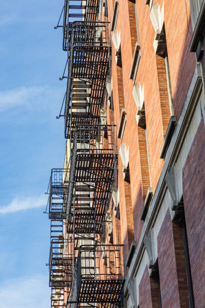 istock Metal fire escape on an older brick building. 1365468300