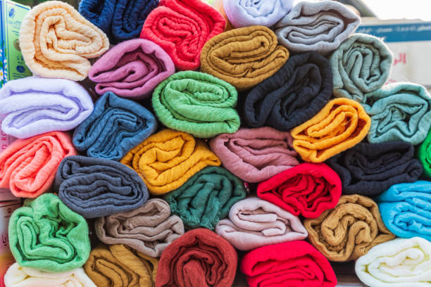 istock Folded colorful fabric for sale. 1365468405
