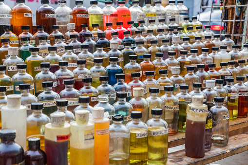 Harlem, Manhattan, New York City, New York, USA. November 4, 2021. Aromatic oils being sold by a sidewalk vendor.