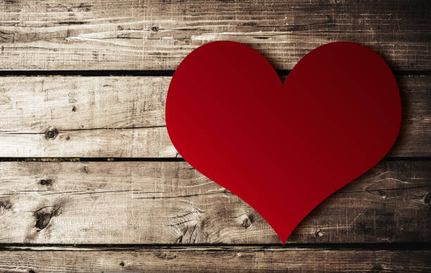 istock st. valentine heart shape on plank wood 1365474386
