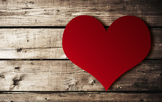 st. valentine heart shape on plank wood