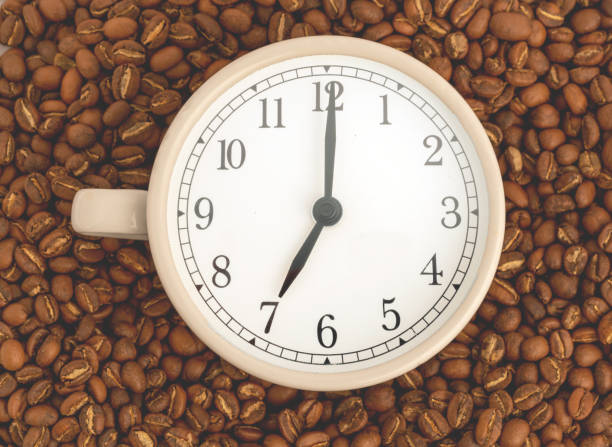Clock symbol with frothy coffee. 'Coffee Time' Concept.