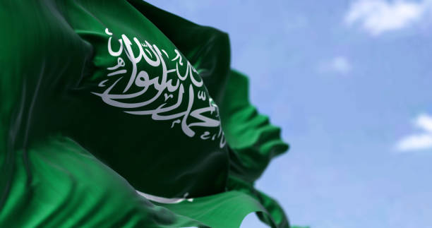 Detailed close up of the national flag of Saudi Arabia waving in the wind on a clear day stock photo