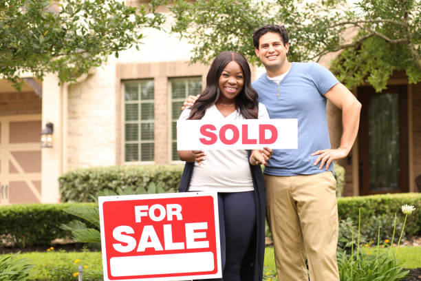 istock Excited young couple buying a home. 1365481468