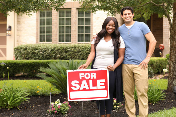 istock Excited young couple buying a home. 1365481570