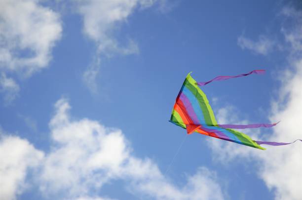 istock colorful kite flying in the blue sky 1365482569