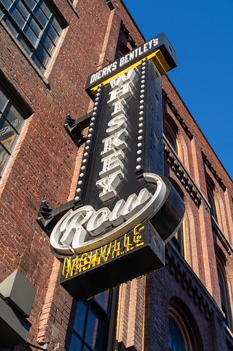 Nashville, Tennessee - January 10, 2022: Dierks Bentley's Whiskey Row, a famous honky tonk bar with live music, on Broadway, is popular with tourists