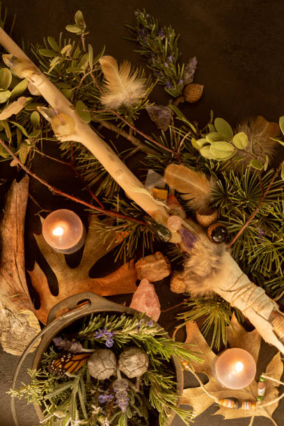 istock A cauldron full of herbs, a magic wand with crystals, burning candles, herb lore, witch story, occult flat lay 1365491320