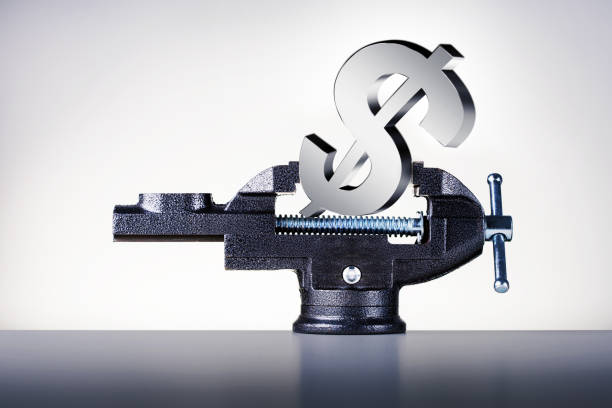 istock Dollar in vise. Financial crisis, devaluation, inflation concept. 1365491962