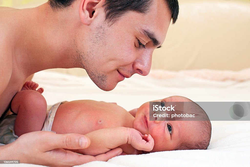 Young father and newborn baby boy Portrait of young father and newborn baby boy Above Stock Photo