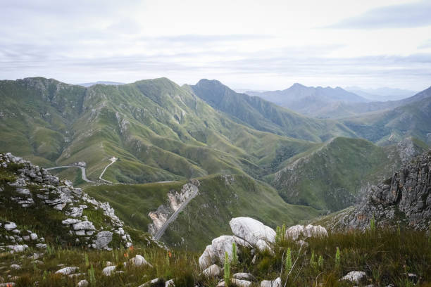istock High angle view over a mountain pass winding over the mountains near George 1365511404