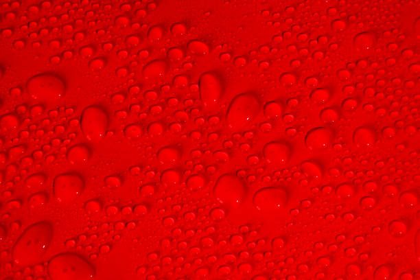 istock Transparent clear red liquid serum gel smudge with bubbles textured background 1365516194