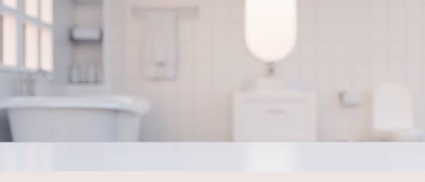 istock Copy space on white tabletop over blurred luxury white bathroom interior 1365516609