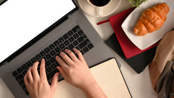 istock Overhead shot of college student using laptop computer. 1365517410
