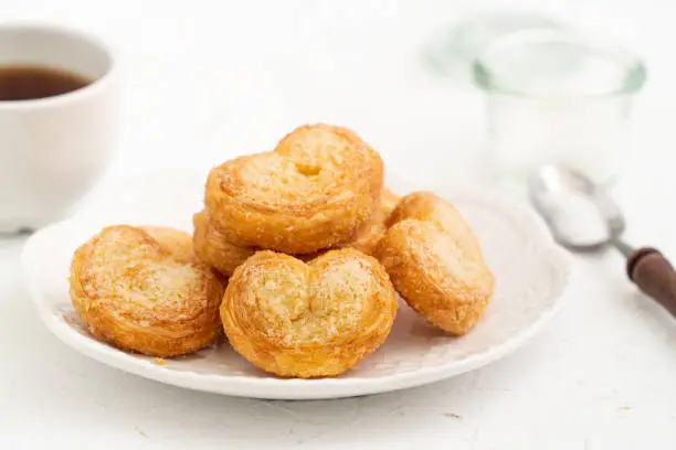 Photo of Delicious Palmier butterfly pastry in heart shape for Valentine's day dessert.