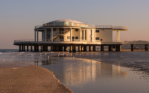 Senigallia, Italy - January 17, 2022: Photo of the Rotonda a mare in Senigallia (Marche, Italy) with reflection on the water. La Rotonda a Mare is a structure, created for hydrotherapy and recreational purposes, overlooking the sea of Senigallia, now home to exhibitions and conferences during the summer.