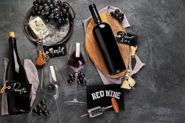 istock Red wine assortment with appetizers on gray background. 1365532217